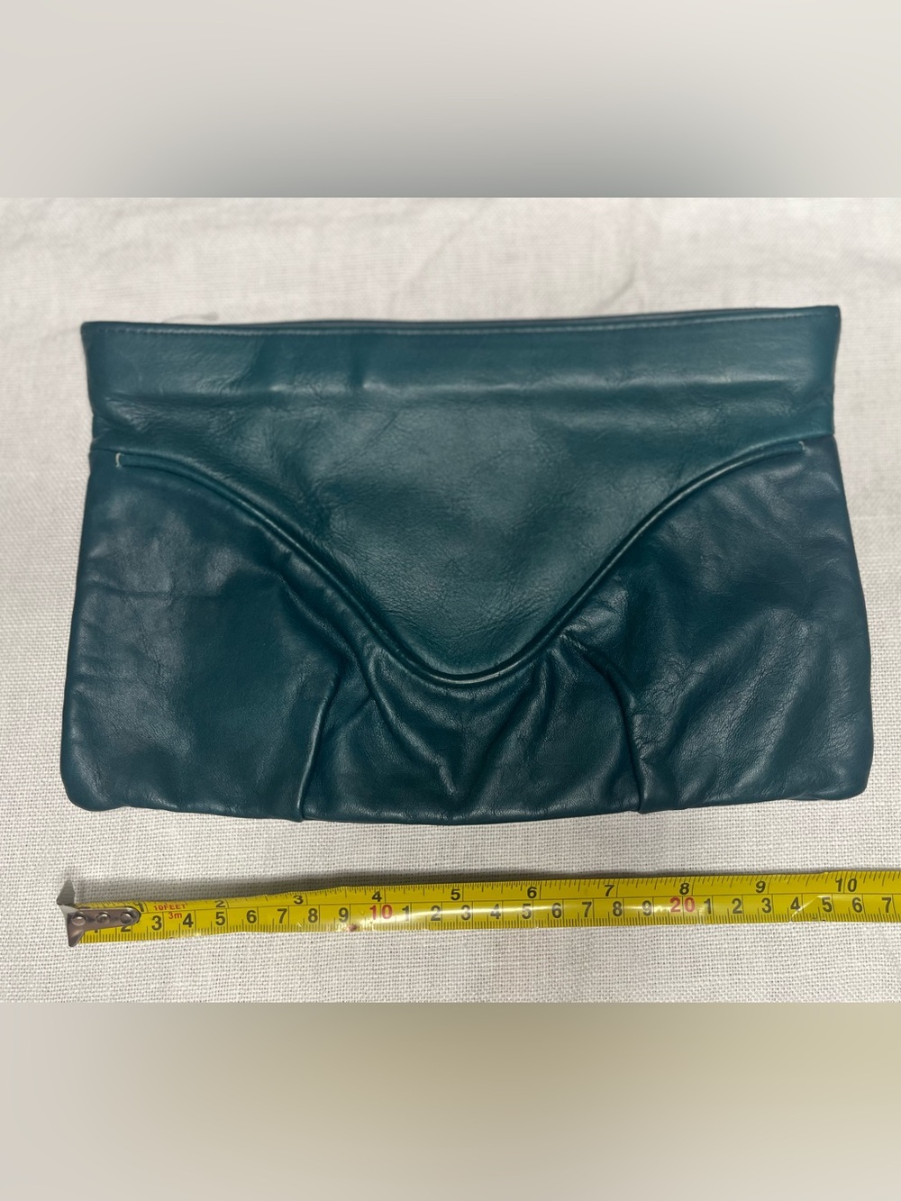 Vintage teal colored leather clutch